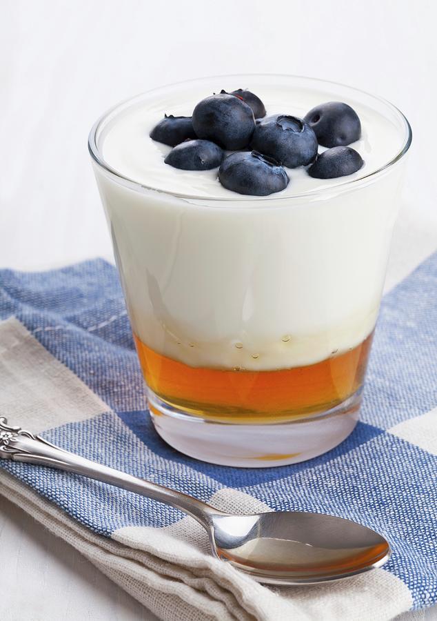 Natural Yogurt On Honey Topped With Blueberries In A Glass Photograph by Shawn Hempel