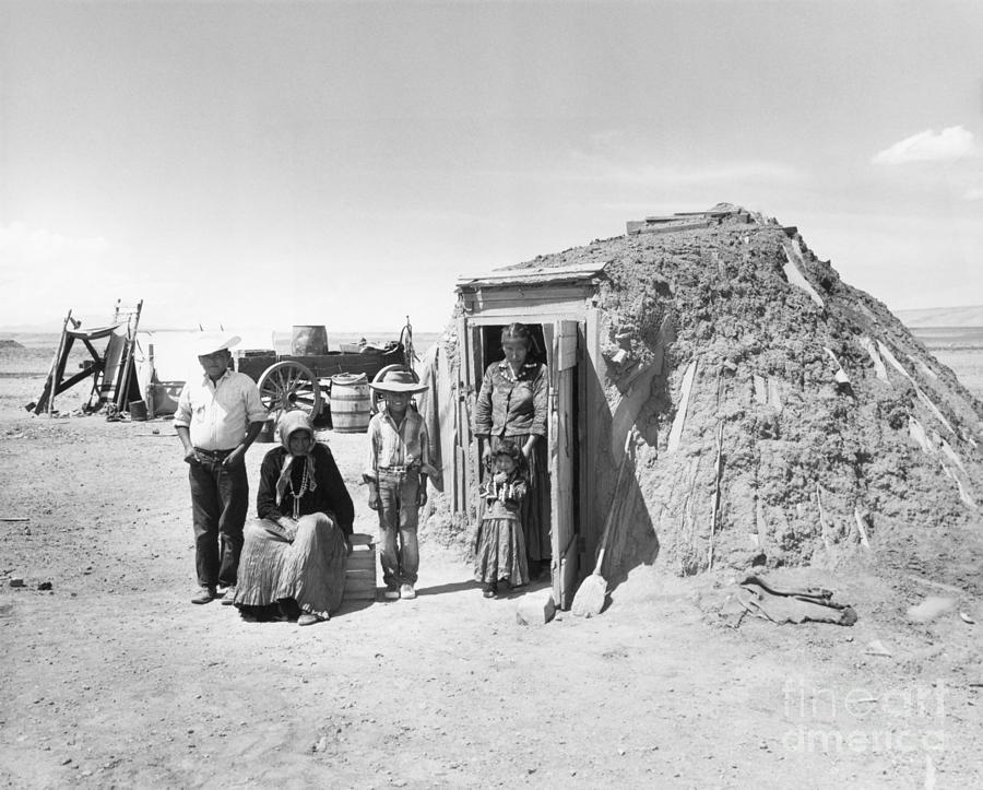 Navajo Family Outside Hogan Photograph by Bettmann