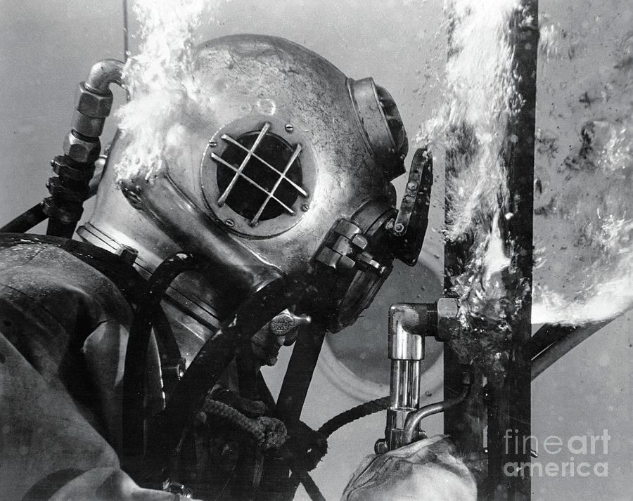 Navy Diver Cutting Into Shipwreck Photograph by Bettmann