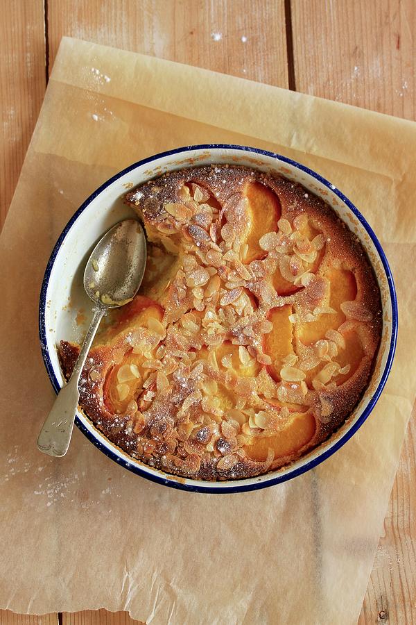 Nectarine Clafoutis With Flaked Almonds Photograph by Carmen Mariani