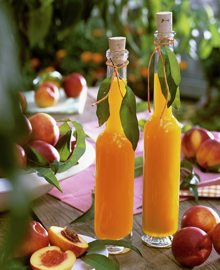 Nectarine Juice And Fresh Nectarines Photograph by Strauss, Friedrich