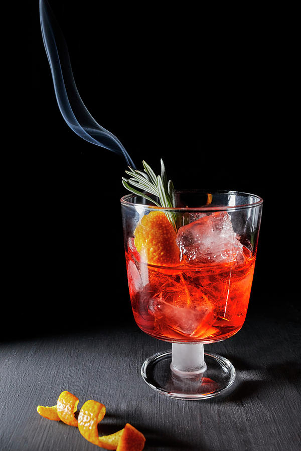 Negroni With A Smoldering Rosemary Sprig Photograph by Natasa Dangubic