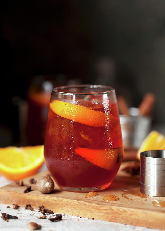 Negroni With Roasted Oranges And Spices Photograph by Jane Saunders