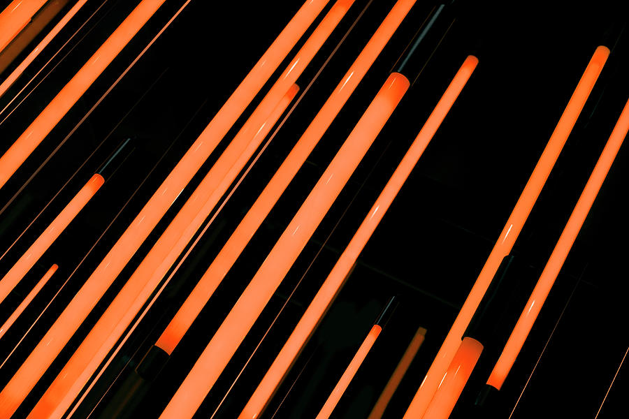 Neon Orange Rods Of Glowing Light Photograph by Ralf Hiemisch