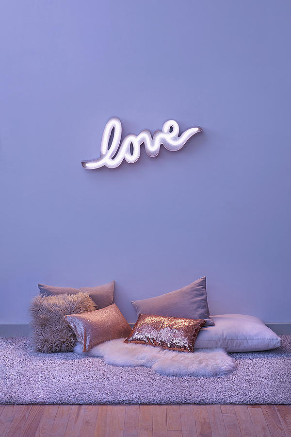 Neon Wall Light Spelling love And Various Cushions On The Floor Photograph by Frdric Jacquet