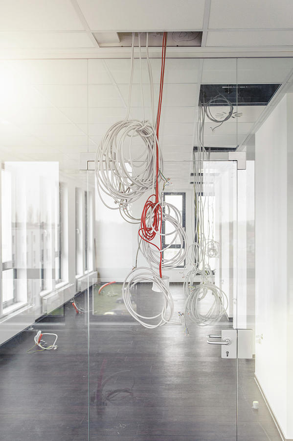 https://images.fineartamerica.com/images/artworkimages/mediumlarge/2/network-and-power-cables-hanging-from-new-office-corridor-ceiling-suedhang.jpg