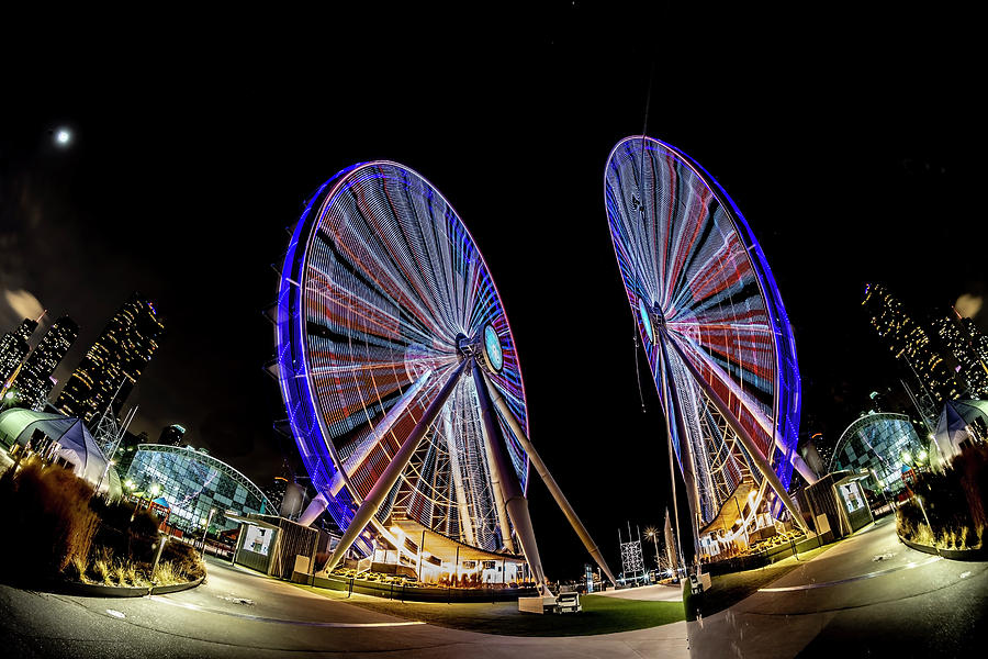 New ferris wheel and its reflection Photograph by Sven Brogren