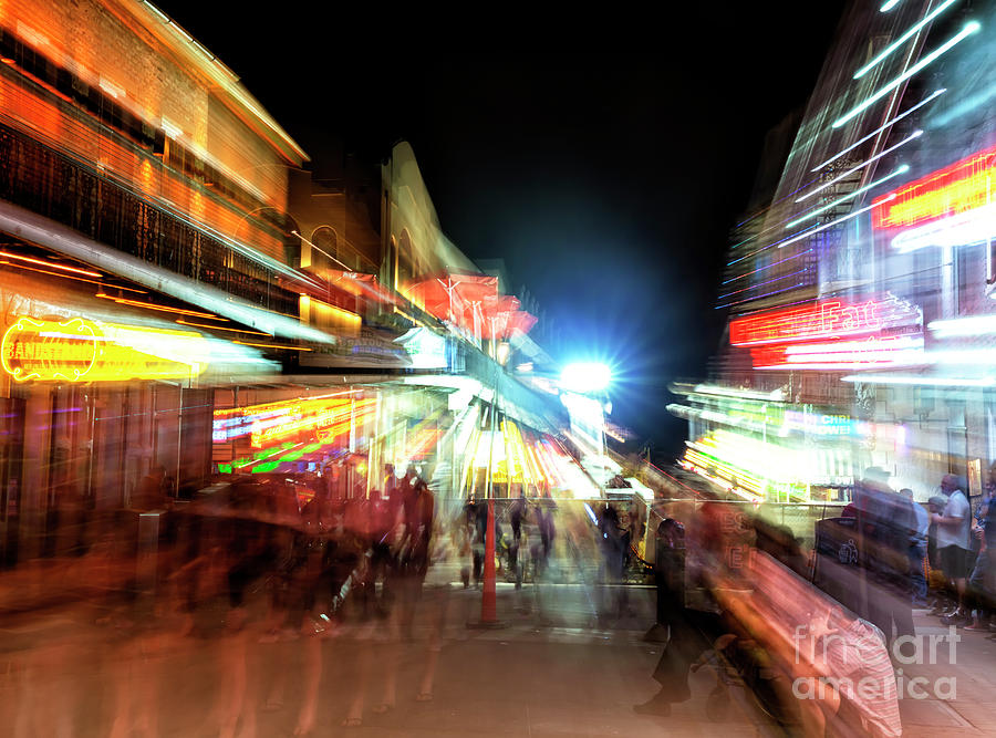 New Orleans Motion on Bourbon Street at Night Photograph by John Rizzuto