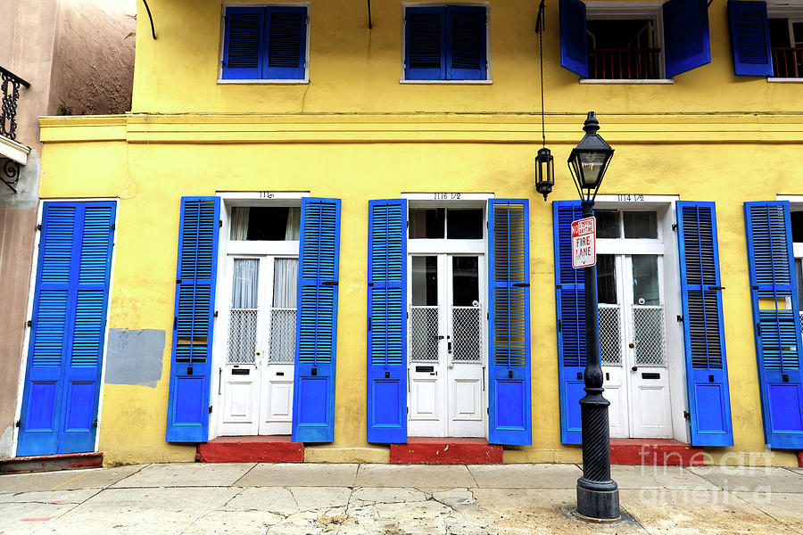 Architecture Photograph - New Orleans Yellow Row House Style by John Rizzuto