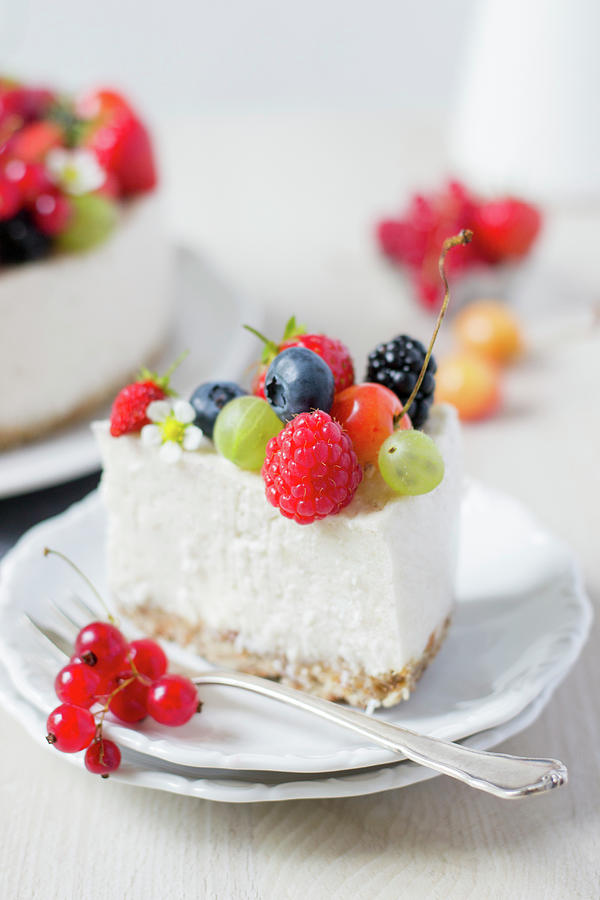 New York Cheesecake With Berries Photograph by Jennifer Mnchmeier