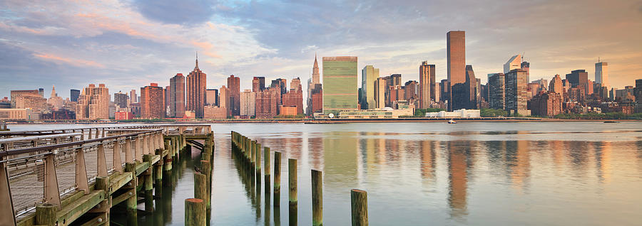 New York City, Queens, View From Gantry Plaza State Park At Sunrise Showing The Manhattan Skyline And The United Nations Headquarters Digital Art by Luigi Vaccarella