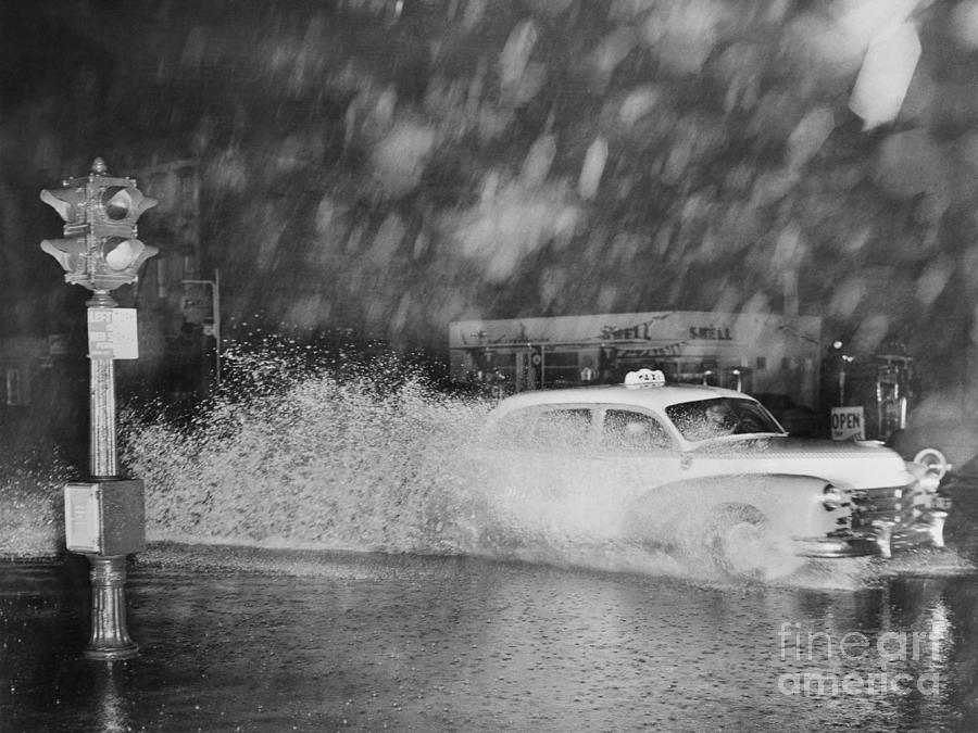 New York Taxi Driving Through Hurricane Photograph by Bettmann