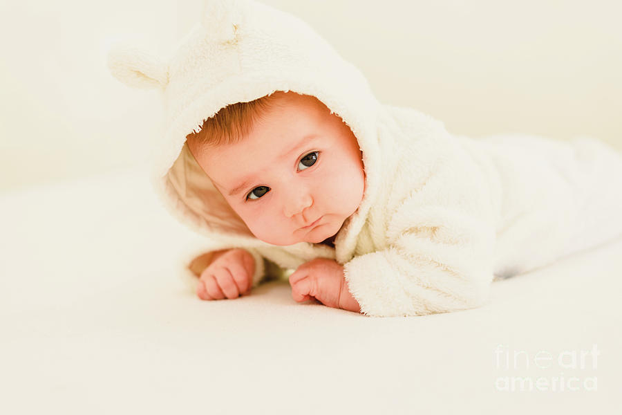 Newborn blonde baby 3 months old lying on her stomach and head raised Photograph by Joaquin Corbalan