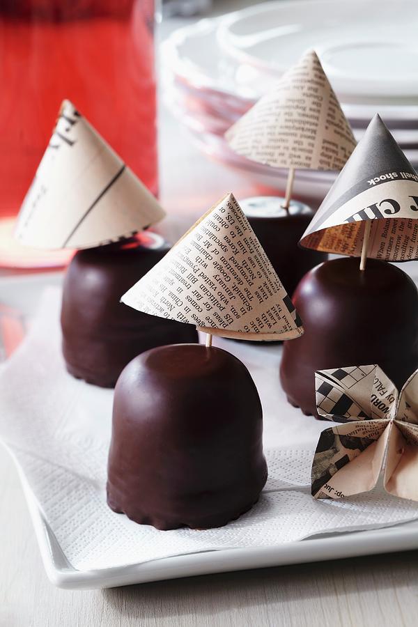 Newspaper Cocktail Umbrellas Decorating Chocolate Teacakes Photograph by Franziska Taube