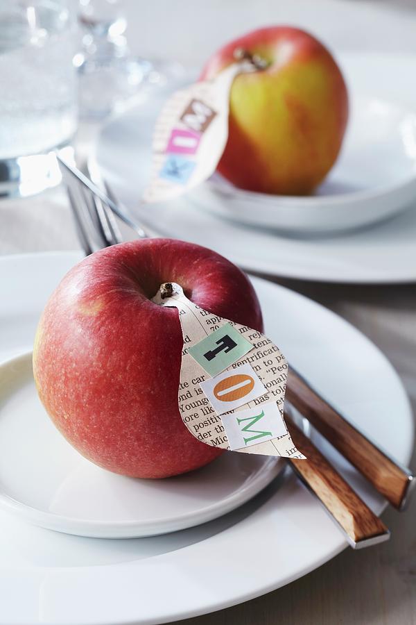 Newspaper Name Tags On Apples Photograph by Franziska Taube