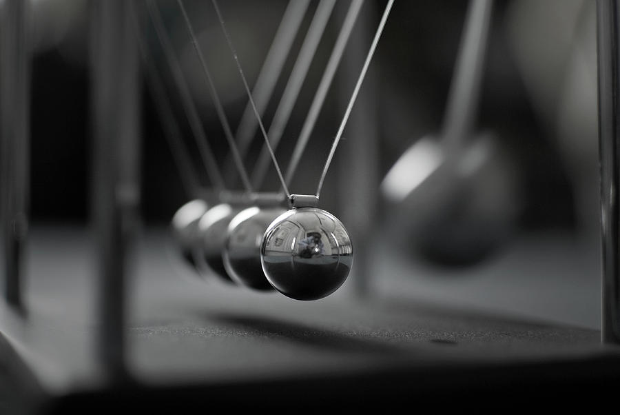 Newtons Cradle In Motion - Metallic Photograph by N.j. Simrick