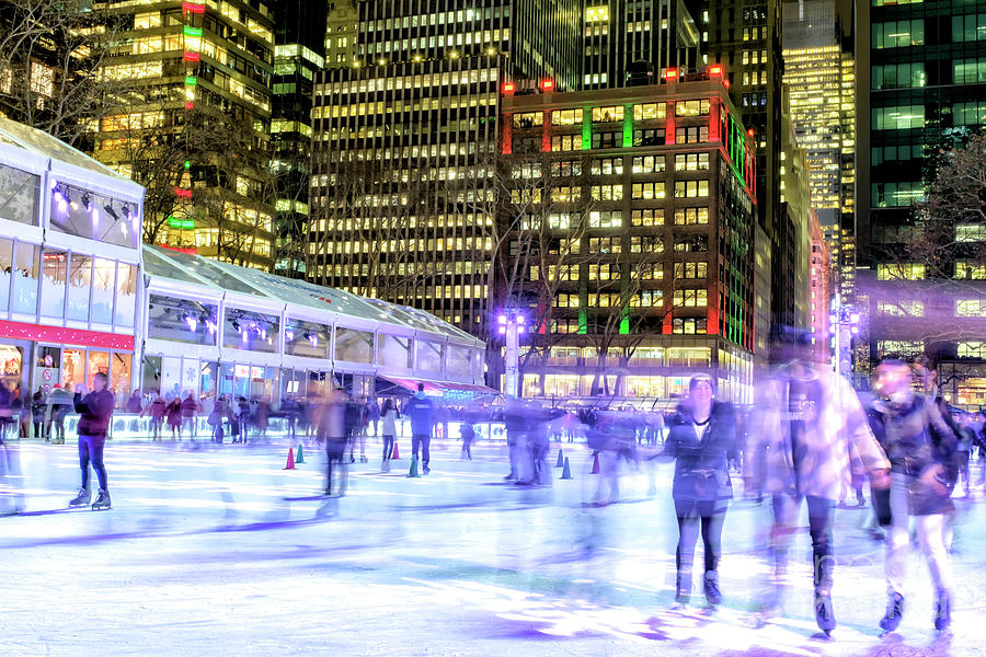 Night Skating at Bryant Park in New York City Photograph by John Rizzuto