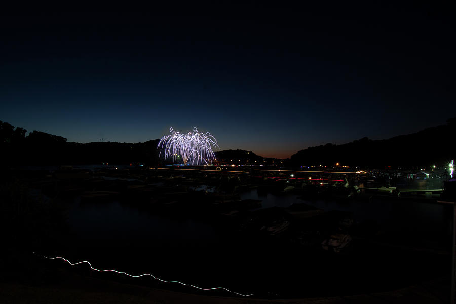 Nighttime fireworks on lake Photograph by Dan Friend