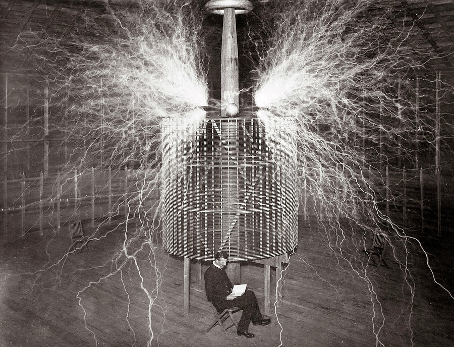 Nikola Tesla Sitting In His Colorado Springs Laboratory With His Magnifying Transmitter Photograph by Unknown