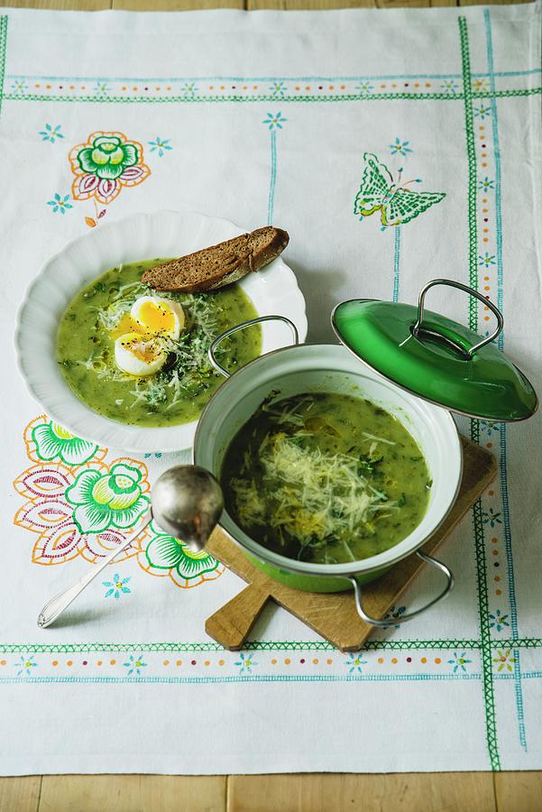 Nine-herb Soup Served With Soft Eggs And Bread Photograph by Hans Gerlach