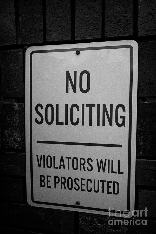 no soliciting violators will be prosecuted sign at the entrance to a ...