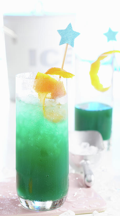 Non-alcoholic blue Ocean Cocktail With Passion Fruit, Grapefruit And Curacao Photograph by Teubner Foodfoto