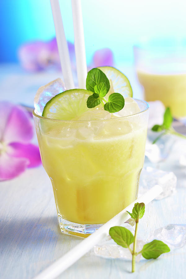 Non-alcoholic Exotic Fruit Drink With Pineapple, Grapefruit, Lime And Coconut Milk Photograph by Teubner Foodfoto