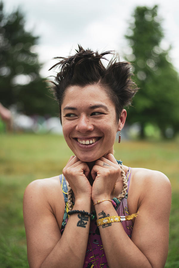 Non Binary Asian Smiles In Colourful Croptop At Festival Camp Photograph By Cavan Images Fine 2121