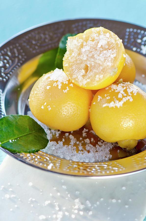 North African Salted Lemons In A Metal Bowl Photograph by Jamie Watson