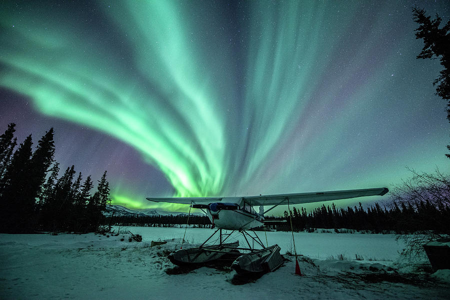 Northern Lights Above A Plane At Night Photograph by Jonathan Tucker