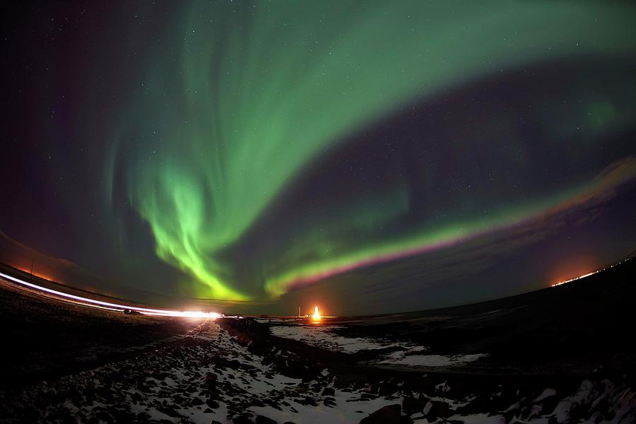 Northern Lights In Reykjavik, Iceland Photograph by Arctic-images