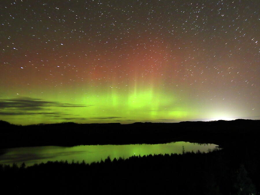 Northern lights on lake Superior in Minnesota Photograph by Alex Nikitsin