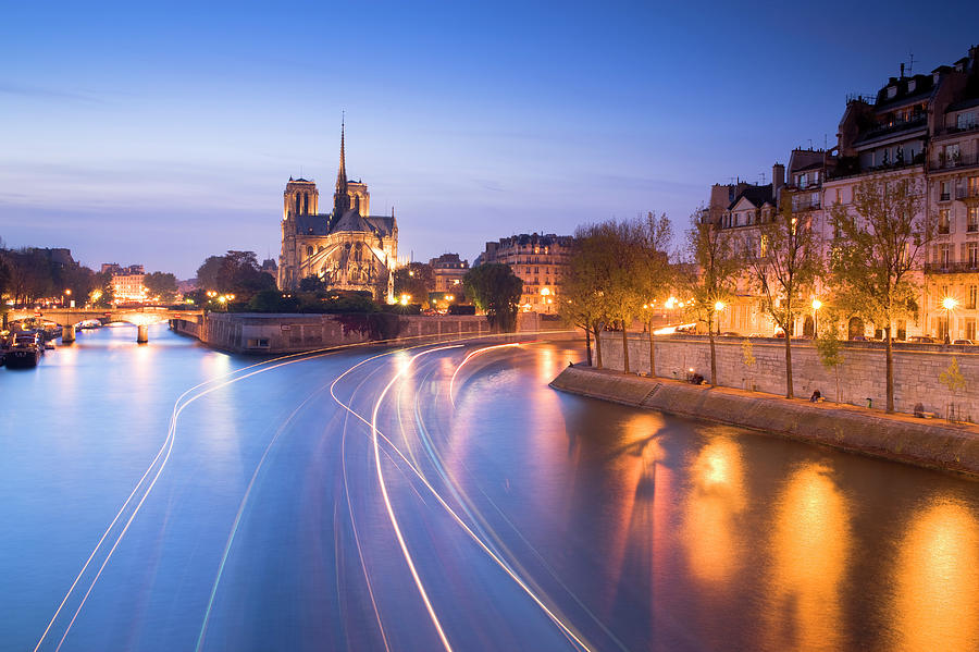 Notre Dame Viewed Over The River Seine Photograph by Travelpix Ltd