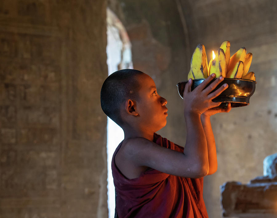 Novice Monk Making An Offering Photograph by Ann Moore