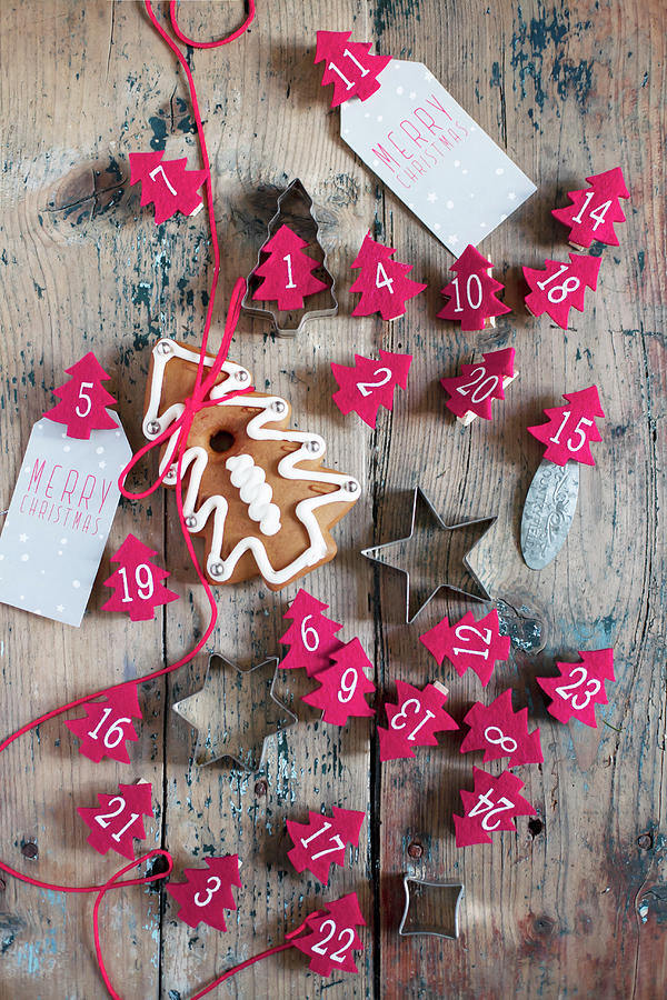 Numbered Christmas Trees Made From Red Felt And Pastry Cutters Photograph by Alicja Koll