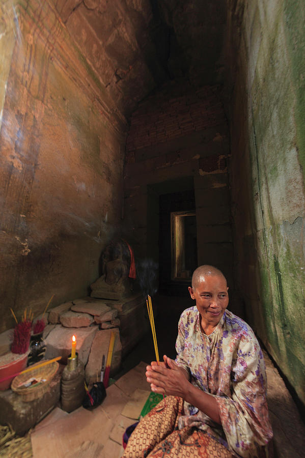 Nun Burning Incense In Temple Photograph by Cultura Rm Exclusive/stuart Westmorland