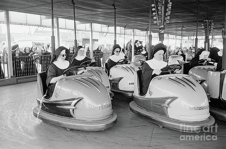 Nuns Driving Amusement Park Bumper Cars Photograph by Bettmann