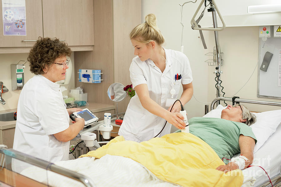 Nurse And Trainee Performing Abdominal Ultrasound Photograph by Arno ...