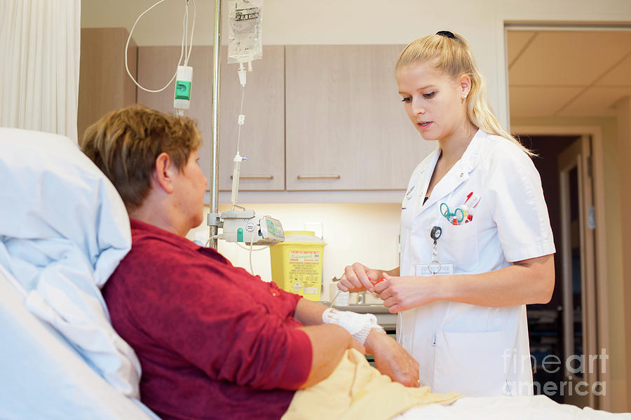 Nurse Trainee With A Patient by Arno Massee/science Photo Library