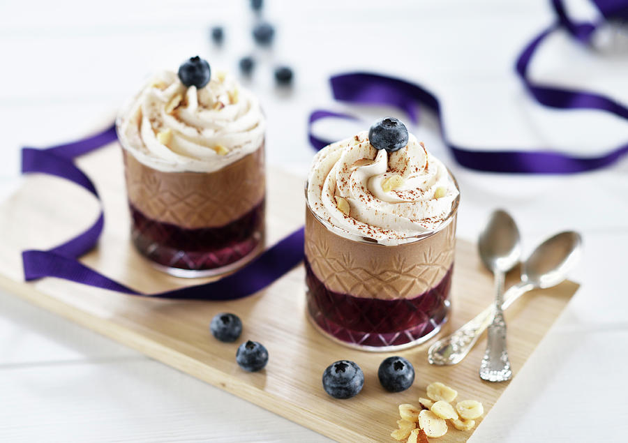 Nut And Nougat Mousse In Glasses With Blueberries And Whipped Cream, Served On A Wooden Board vegan Photograph by B.b.s Bakery