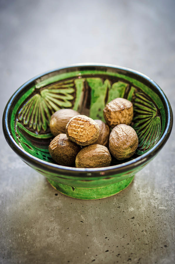 Nutmegs In A Little Bowl Photograph by Aniko Szabo