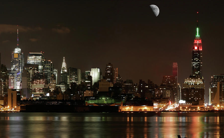 Nyc - Midtown Beneath The Moon Photograph by Tbabasade