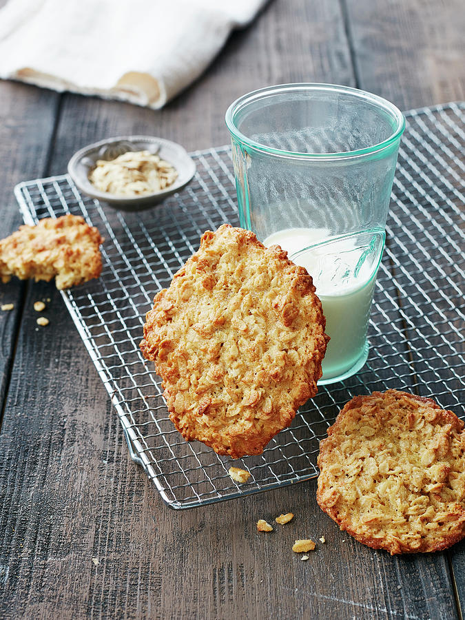 Oat Biscuits And A Glass Of Milk Photograph by Rafael Pranschke