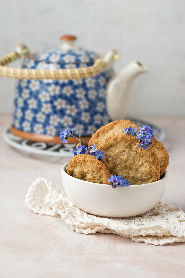 Oat Biscuits With Forget-me-nots And A Teapot Photograph by Mandy Reschke