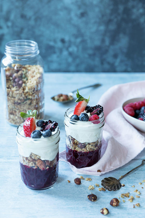 Oat Granola With Nuts And Dreid Fruit With Fruit Puree, Berries And Yogurt Photograph by Joan Ransley