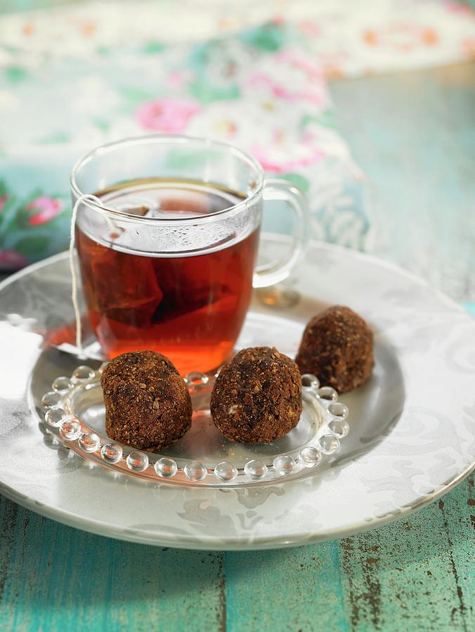 Candy Photograph - Oatmeal, Fenugreek And Carouba Flour Truffles With A Cup Of Tea by Lawton