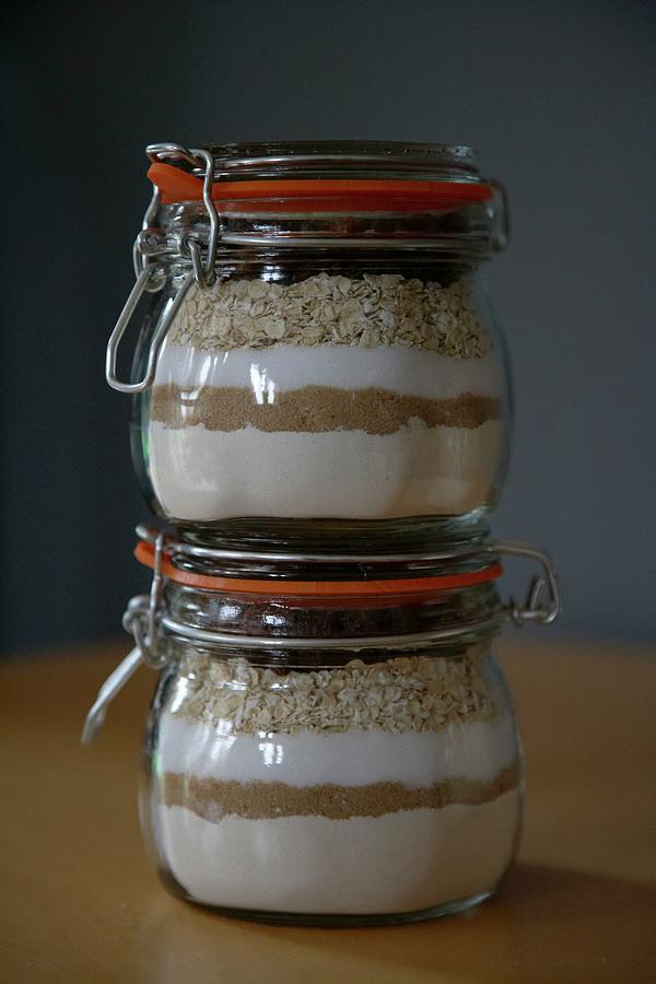 Oatmeal Raisin Cookie Mix In Preserving Jars Photograph by Charlotte Murphy