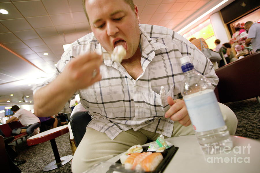 Obese Man Eating Sushi Photograph by Michael Donne/science Photo Library