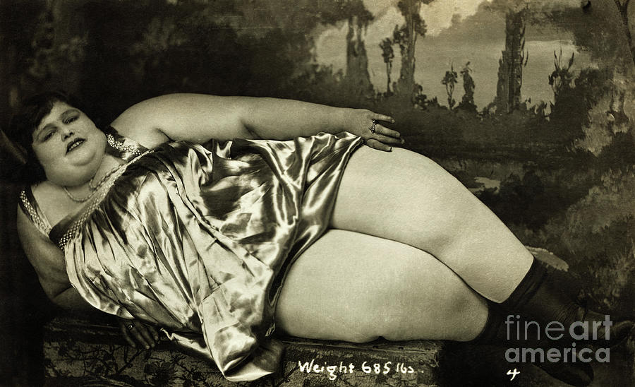 Obese Woman Lying On Chair Photograph by Bettmann