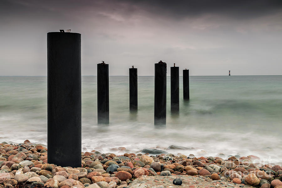 Ocean pier posts Photograph by Sophie McAulay